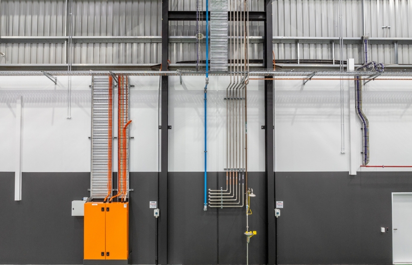 NRG Services team showcasing commercial electrical fit out at RDO Equipment Facility - mains switchboard, power factor correction unit and distribution boards.